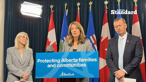 Premier Danielle Smith and Minister Mike Ellis speaking to reporters