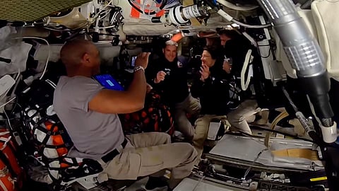 The Artemis II crew present Canadian astronaut Jeremy Hansen (second from left) with his Gold Wings signifying his first flight into space. 