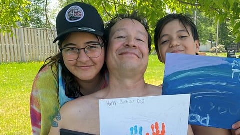 Doug Riffel with two of his children