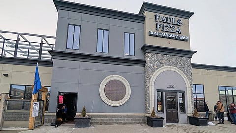 A popular Airdrie pizzeria is once again facing backlash after a social media post sparked controversy, splitting commentators down left- and right-wing political lines.