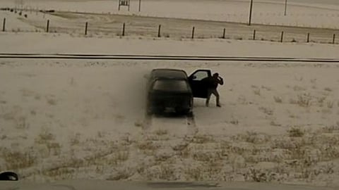 Suspects holds gun to his head