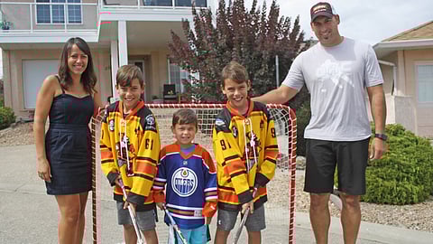The Lacey family enjoys a summer street hockey game in Osoyoos. From left: Mom, sons (left to right) with jersey numbers 61, Oilers jersey, and 91, and Dad.