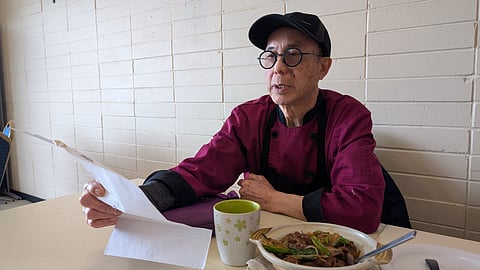 Andrew Mok looks at his list of charges for selling fish illegally.