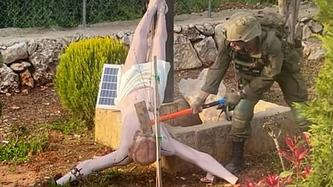 A photo of an Israeli soldier destroying a statue of Jesus Christ with a sledgehammer in a southern Lebanese village that is home to Christians has been confirmed to be real, causing widespread condemnation.