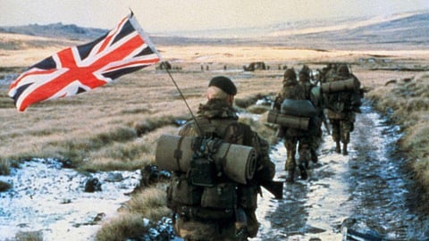 A British solider 'yomping' towards Stanley during the 1982 Falklands War