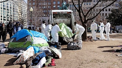Crews clean up a homeless encampment