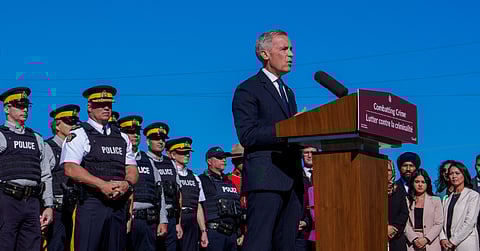 Canadian Prime Minister Mark Carney makes a crime announcement alongside RCMP members 