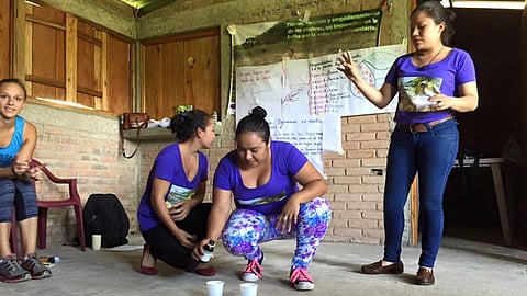 Young Nicaraguan women are trained in organic soil testing and are showing some American buyers and consumers how they test soil for minerals.