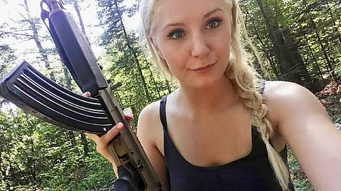 Lauren Southern with an AK-47-style rifle 