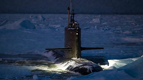 A submarine breaks through the arctic ice