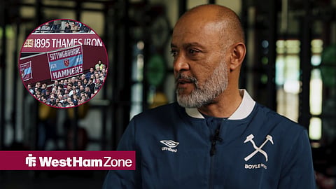 Nuno Espirito Santo speaking during an interview, while looking at West Ham fans in the London Stadium.