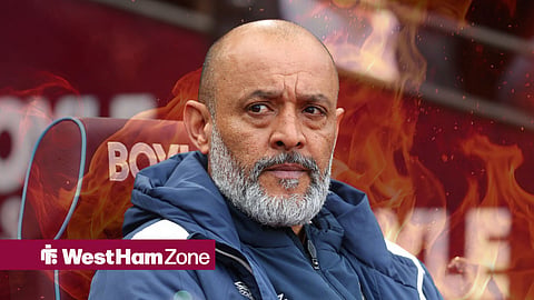 Nuno Espirito Santo with fire behind him.