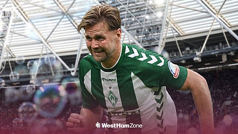 Niclas Fullkrug in action for Werder Bremen with London Stadium in the back